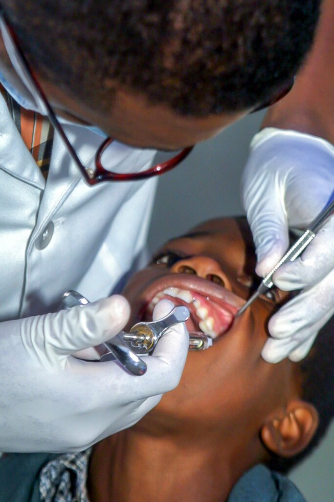 dentist in Lagos examining patient