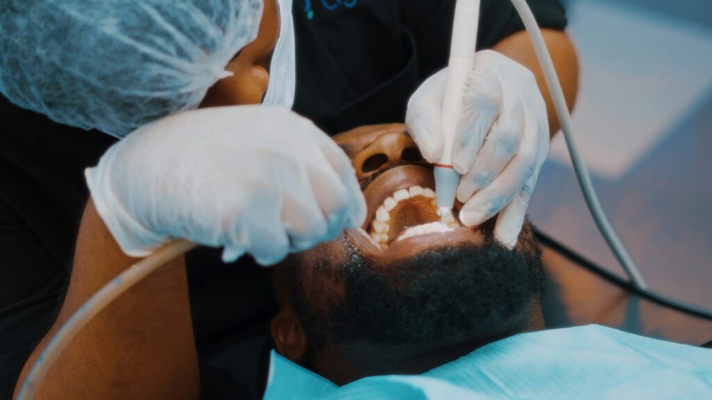 dentist in Lagos examining patient